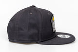 Solid charcoal grey, New Era 9Fifty, Snapback with yellow wings/grey logo